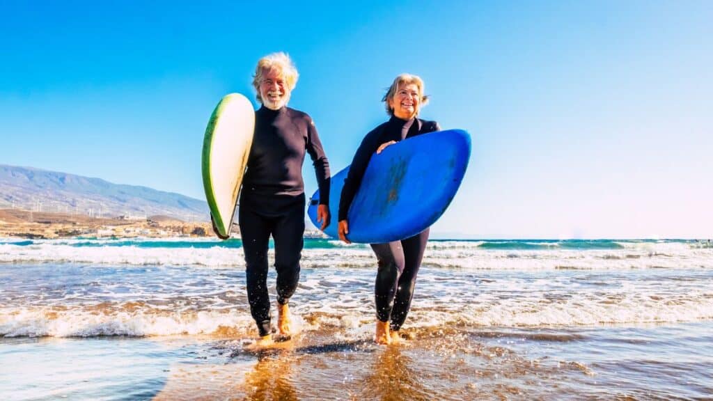 senior-couple-surfing